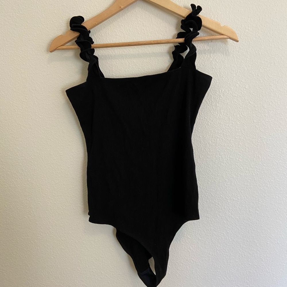 black reformation ruffle sleeve body suit